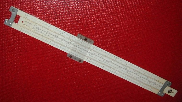 Dividers and scale rule on a plate