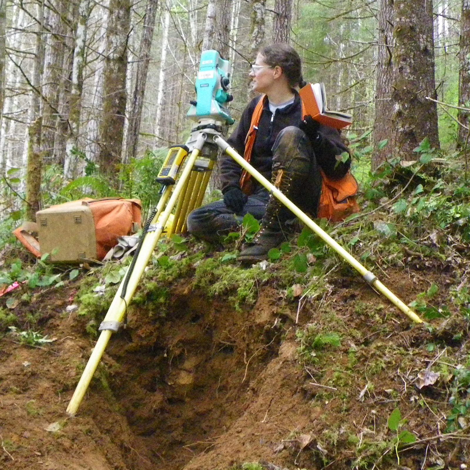 A surveyor at the instrument
